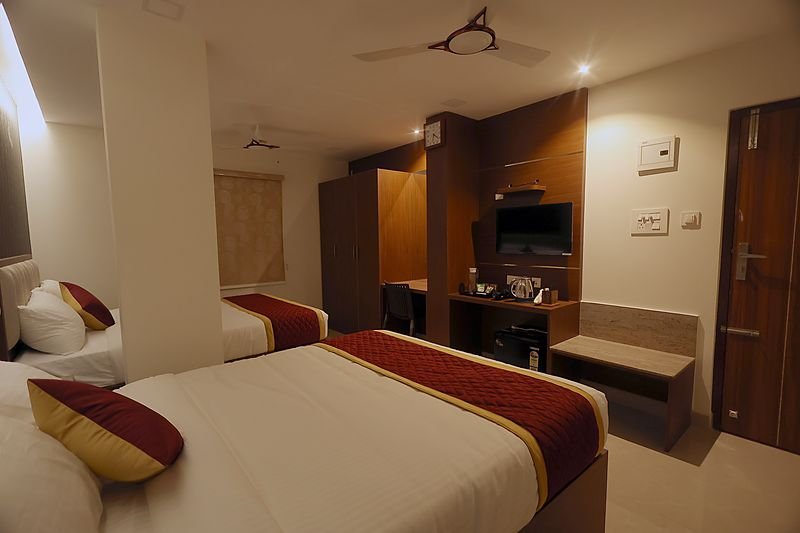 King Suite seen across both beds