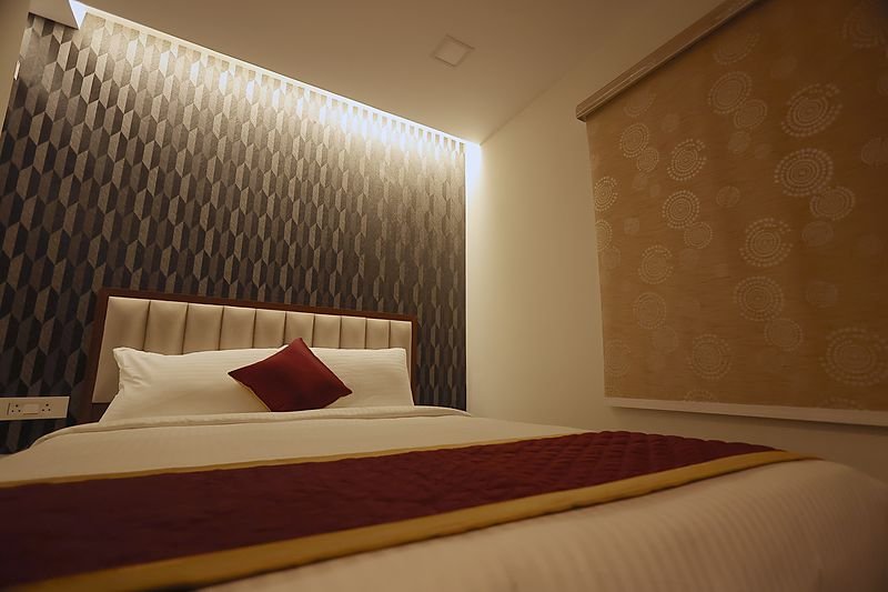 Executive Room at SRK Clasic with a lit feature wall