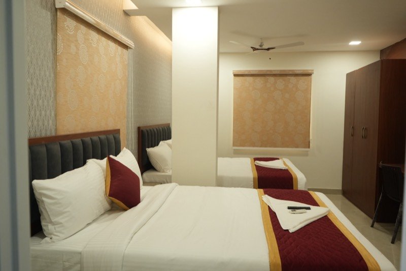 Larger Premium room laid out with two king beds