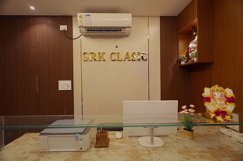 Front desk with the brass SRK Clasic signage