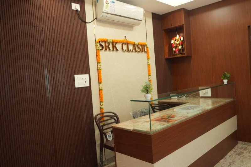 Reception desk with the SRK Clasic brass signage behind it